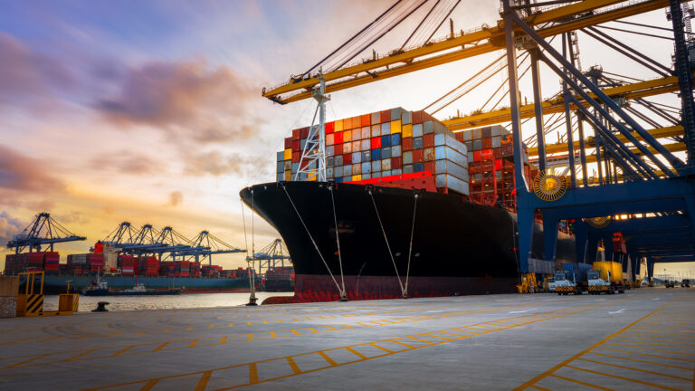 Crane loading Cargo Container export container ship in the inter